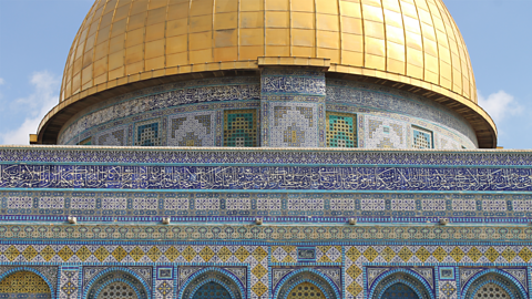 This is the Dome of the Rock in Jerusalem. It shows how Arabic calligraphy and geometric tilework were used for decoration