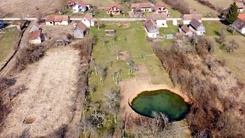 AFP/Getty Images The hole in Borojević's garden has continued to grow since it first appeared and could cost hundreds of thousands of Euros to fill in (Credit: AFP/Getty Images)