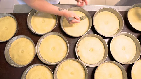 Anna Muckerman Basque cakes are topped with dough and then sealed with a fork (Credit: Anna Muckerman)