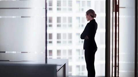 Getty Office worker looking out of a window