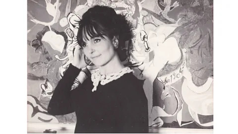 Manuela Morais The artist Paula Rego pictured in 1965 with artwork Stray Dogs (Credit: Manuela Morais)