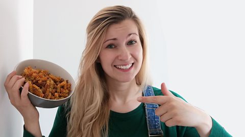 Sophie Whitbread holds "pasta chips" looking bemused