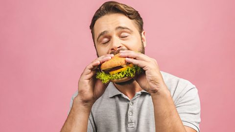 Man eats burger