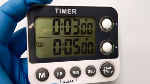 timer held by hand