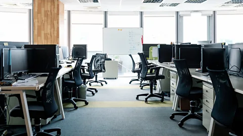 Getty Workdays can be long and tightly controlled - meaning employees are in no hurry to get to their seats early (Credit: Getty)