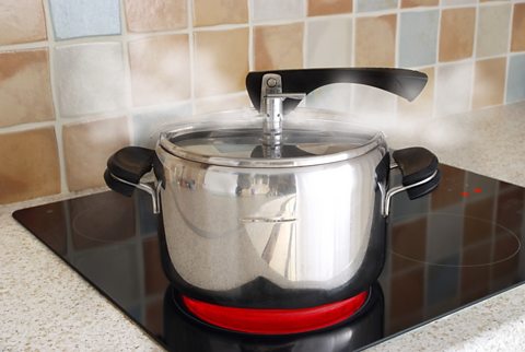 A pan boiling water and producing steam 