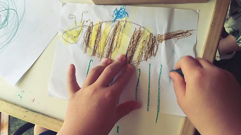 A child's drawing of a bee.