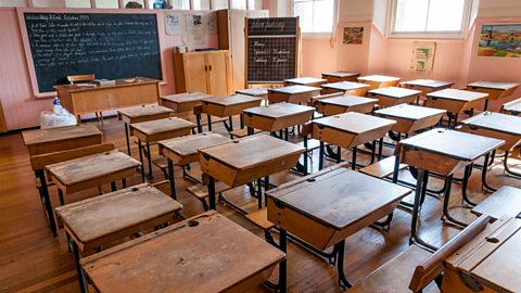 A reconstruction of a typical Victorian classroom, with individual desks for pupils. 