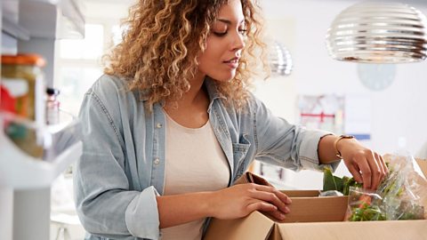 Person opening meal kit