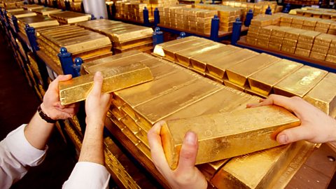 Gold bars being moved