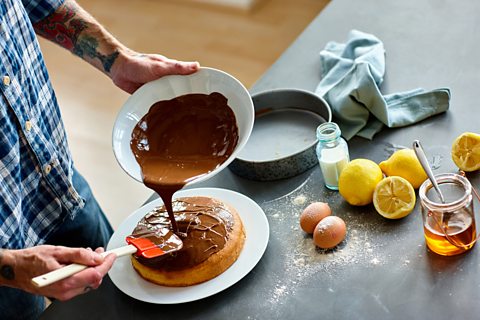 A person baking a cake