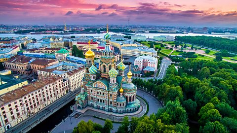 An image of St Petersburg in Russia, with colourful buildings and trees.