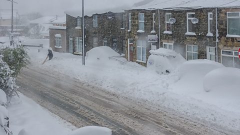 A British street covered in snow and ice