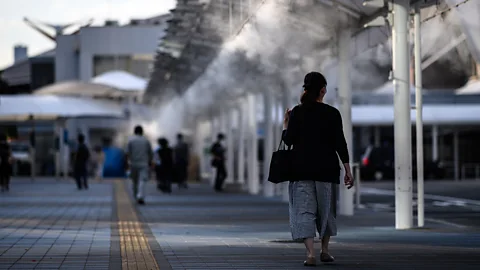 Matthias Hangst/Getty Images The authorities in Tokyo have installed misting stations and shelters that produce a fine spray of cooling water onto passing pedestrians (Credit: Matthias Hangst/Getty Images)