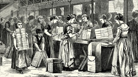Women and children working in a match factory in London. 