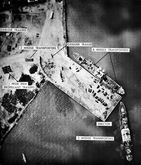 An image of a Soviet missile site, taken by a US spy plane, including a large ship. 