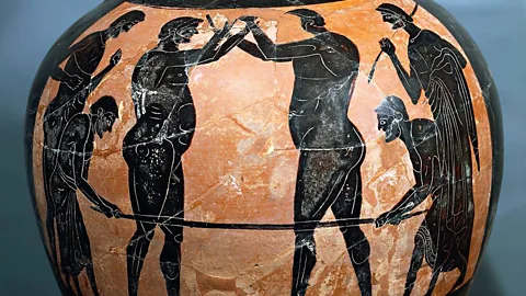 Getty Images A pot from the tomb of a great athlete depicts a fighting scene. Could the distended bellies represent the breathing technique used? (Credit: Getty Images)