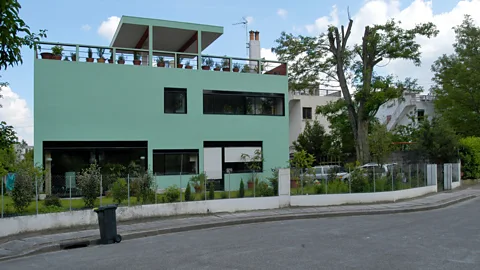 Alamy In Cité Fruges at Pessac, Le Corbusier created worker's housing consisting of a series of rectangular blocks of modular housing units, each with its own terrace (Credit: Alamy)