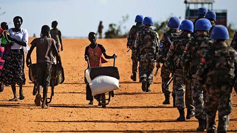 Peacekeeper troops from China deployed by the United Nations Mission in South Sudan (UNMISS), patrol on foot outside the premises of the UN Protection of Civilians (PoC) site in Juba, South Sudan.