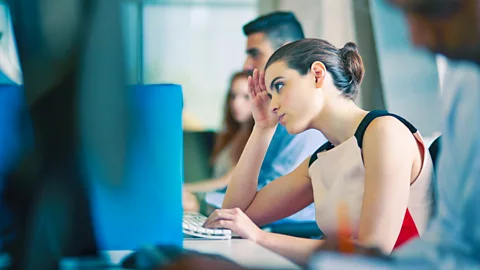 Getty Unhappy woman at her work computer