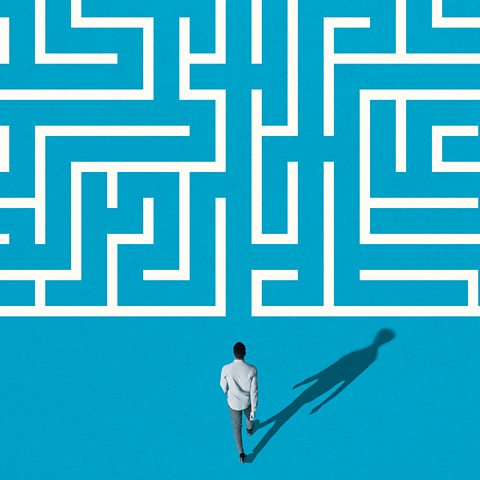 A figure about to enter a maze. 