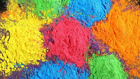 Focus image: many colours of powder paint, as used in Holi celebrations