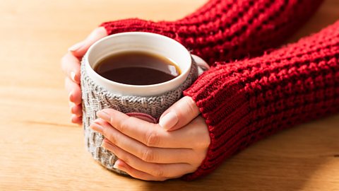 Hands around a cup of tea