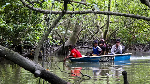 Jefree Salim Boat full of men from Orang Seletar tribe on a wild boar hunt