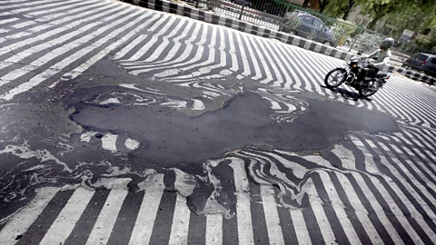 EPA/Harish Tyagi These road markings in India were distorted during a 2015 heatwave (Credit: EPA/Harish Tyagi)