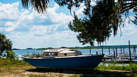 Penny Britt/Getty Images After the oyster industry was devastated in the 1950s, island residents faced the choice of leaving for jobs or living off the land (Credit: Penny Britt/Getty Images)