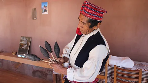 Romel Velasquez Like other males on the island, Alejandro learned how to knit from the men in his family as a child (Credit: Romel Velasquez)
