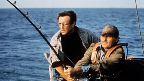 Roy Scheider and Robert Shaw out at sea with fishing rods in Jaws (1975)