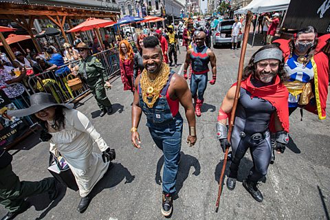 A group of cosplayers march along 5th Avenue during the Opening Ceremonies for the San Diego Cosplayer Community Shrine at San Diego Convention Center on July 23, 2021