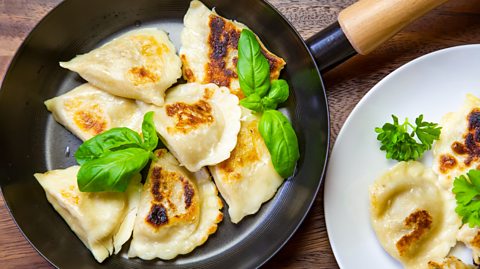 Pierogi in a pan and on a plate