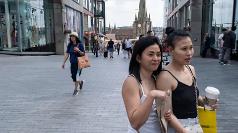 Getty Images Shoppers who bought something for others felt better afterwards compared with those who bought for themselves (Credit: Getty Images)