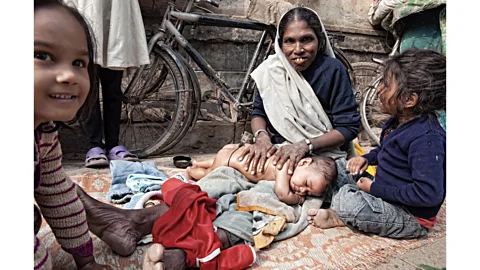 Raquel Maria Carbonell Pagola/Getty Images The techniques for baby massage in India are often passed down from mothers to their daughters (Credit: Raquel Maria Carbonell Pagola/Getty Images)