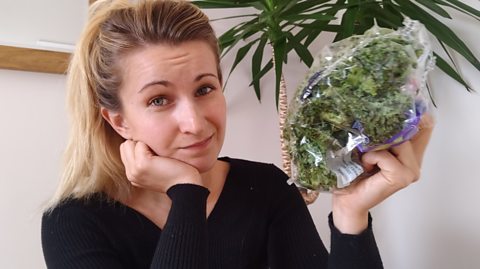 Sophie holding a bag of leaves