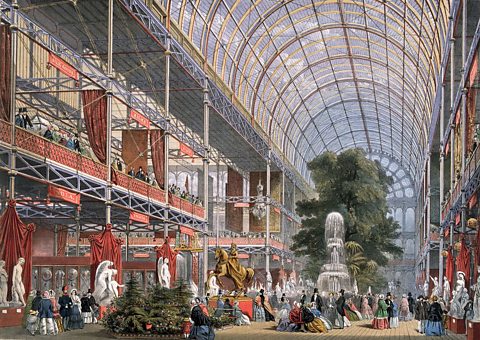 The inside of a large glass building, the Crystal Palace.