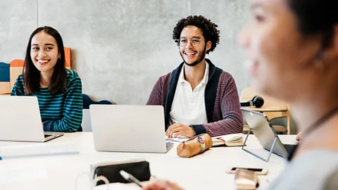 Getty Having helpful, experienced colleagues around is key to learning - but many offices aren't designed to facilitate these interactions (Credit: Getty)