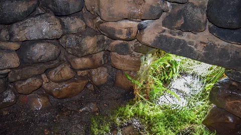 Aidan Harte Sweathouses were made using uncut rock that was piled and bonded into a beehive-like dome with a low entrance and an opening at the top for steam (Credit: Aidan Harte)