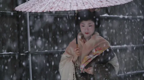 Niigata City Geisha walking in the snow in Niigata City, Japan