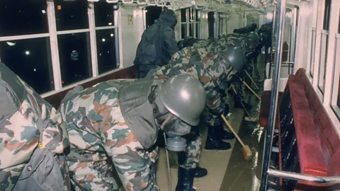 Noboru Hasimoto/Getty Images Soldiers clean a subway train in the wake of the Aum Shinrikyo attack (Credit: Noboru Hasimoto/Getty Images)