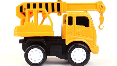 Yellow toy truck with crane attached