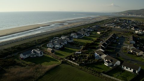 An aerial view of Fairbourne, with the sea in the background.