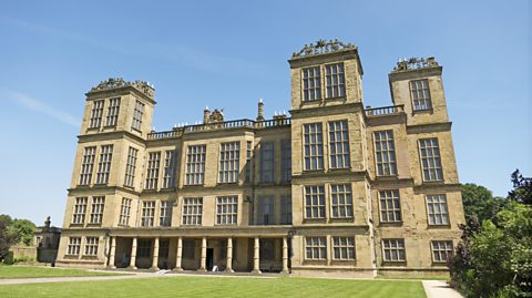 An image of Hardwick Hall on a sunny day. The building has lots of windows.