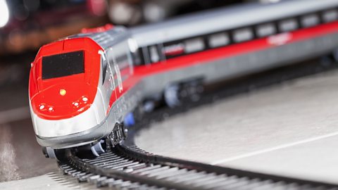 A toy model of a modern train on a track