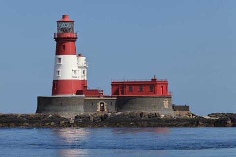 Red and white Longstone Lighthouse in Northumberland. 