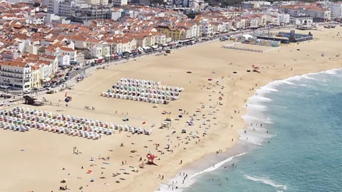 Fernando Trabanco Fotografía/Getty Images Nazaré has long been a popular summer holiday spot, but is now also the epicentre of big wave surfing (Credit: Fernando Trabanco Fotografía/Getty Images)