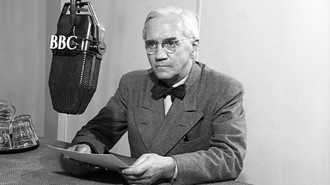 A photo of Alexander Fleming talking into a radio microphone