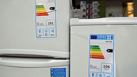 Refrigerators with energy rating labels on the front of them.